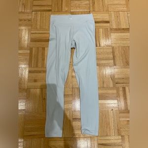 Aritzia TNA criss cross waist band leggings size M in light blue
